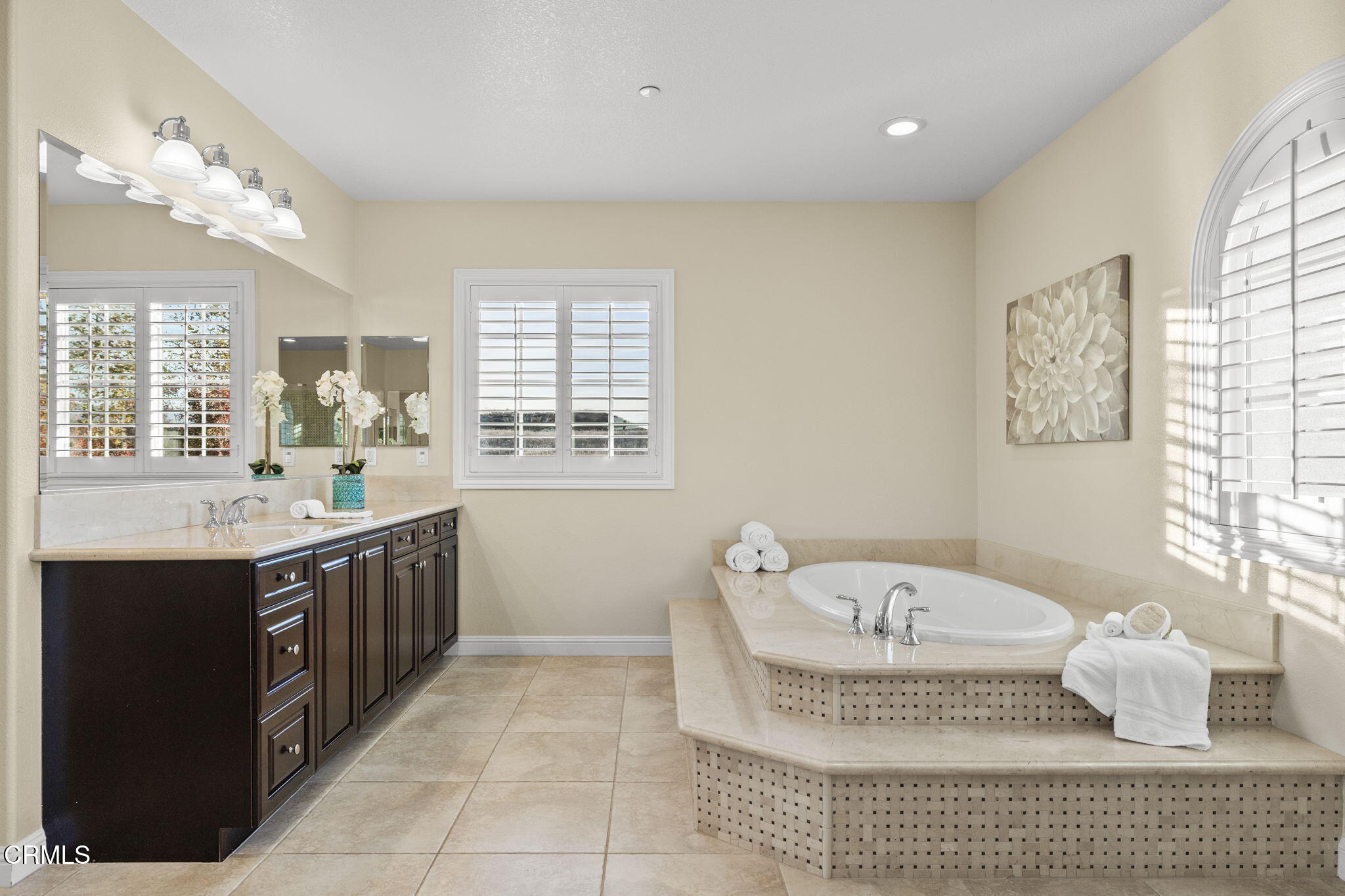 7391 Elk Run Way Moorpark, CA 93021 - Photo 44 of 56 a bathroom with a tub sink and mirror