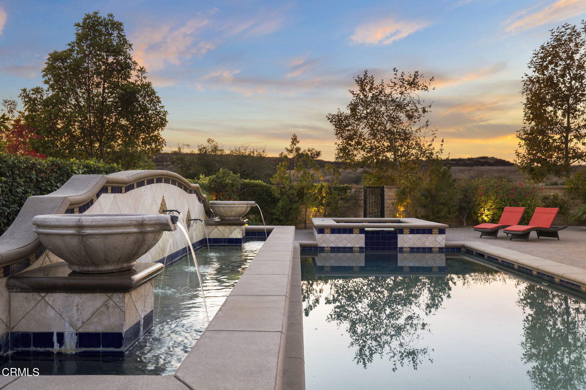 7391 Elk Run Way Moorpark, CA 93021 - Photo 50 of 56 a view of a lake with couches chairs and a fire pit