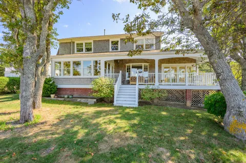 front view of a house with a yard