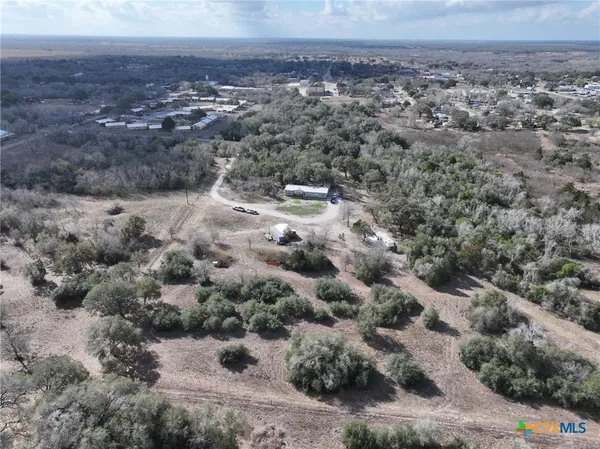 a bedroom with a bed and a night stand