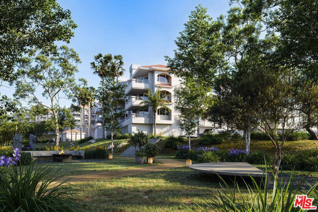 6487 Cavalleri Road, Unit 228 Malibu, CA 90265 - Photo 17 of 18 a view of a lake with a building in the background
