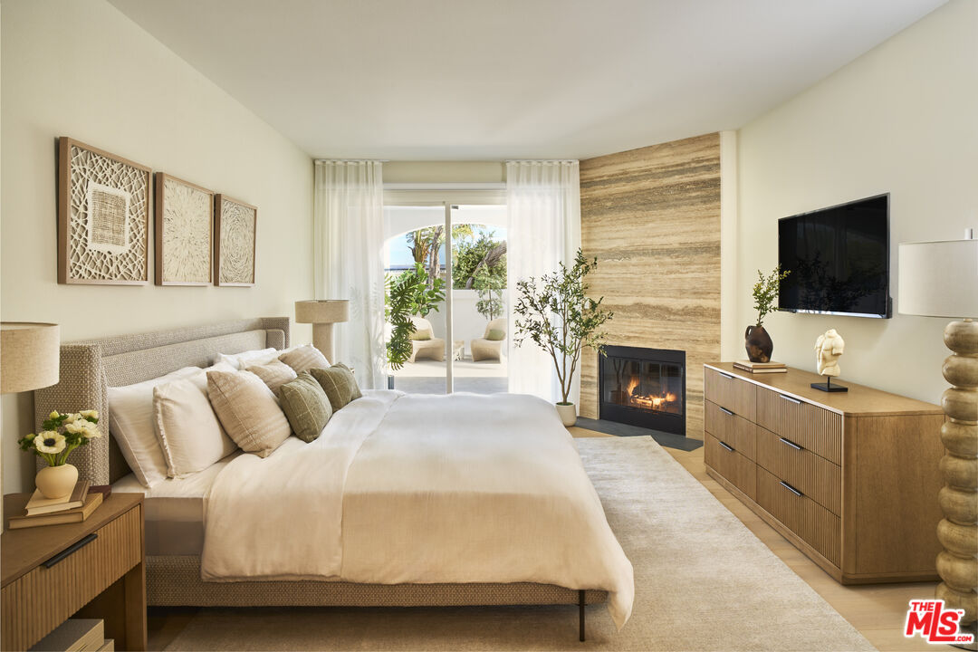 6487 Cavalleri Road, Unit 228 Malibu, CA 90265 - Photo 4 of 18 a spacious bedroom with a bed and a flat screen tv