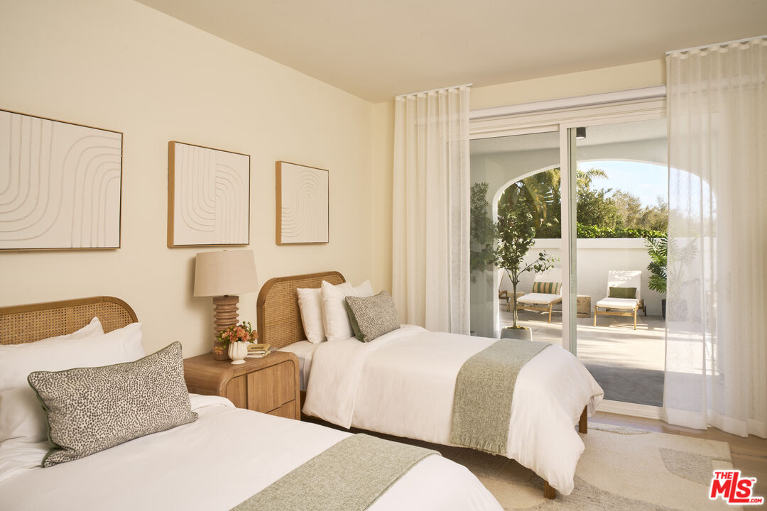 6487 Cavalleri Road, Unit 228 Malibu, CA 90265 - Photo 5 of 18 a bedroom with a bed and a window