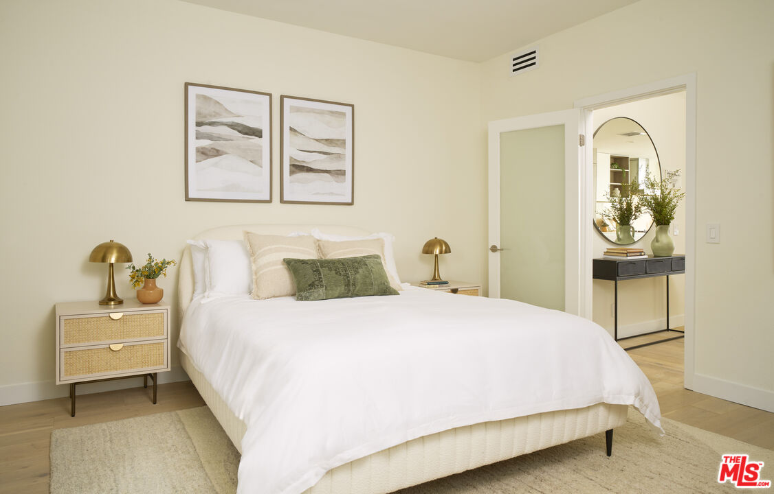 6487 Cavalleri Road, Unit 228 Malibu, CA 90265 - Photo 6 of 18 a bedroom with a bed and a table