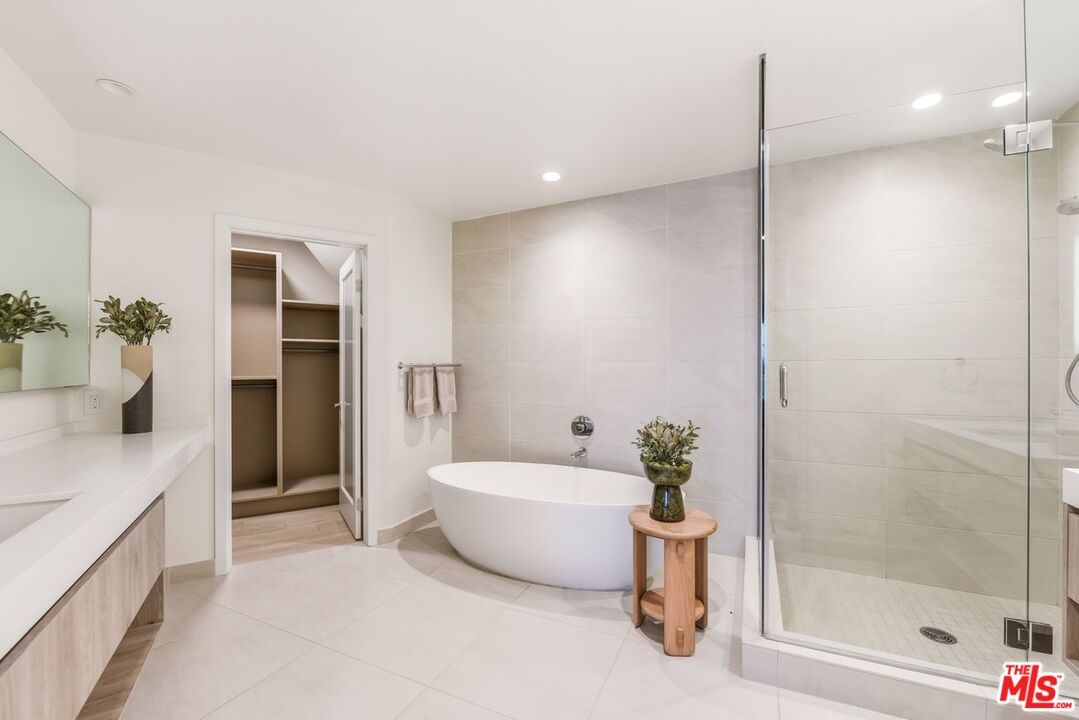 6487 Cavalleri Road, Unit 228 Malibu, CA 90265 - Photo 7 of 18 a bathroom with a bathtub and a shower