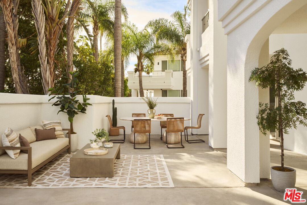 6487 Cavalleri Road, Unit 228 Malibu, CA 90265 - Photo 8 of 18 a view of a patio with couches table and chairs and potted plants
