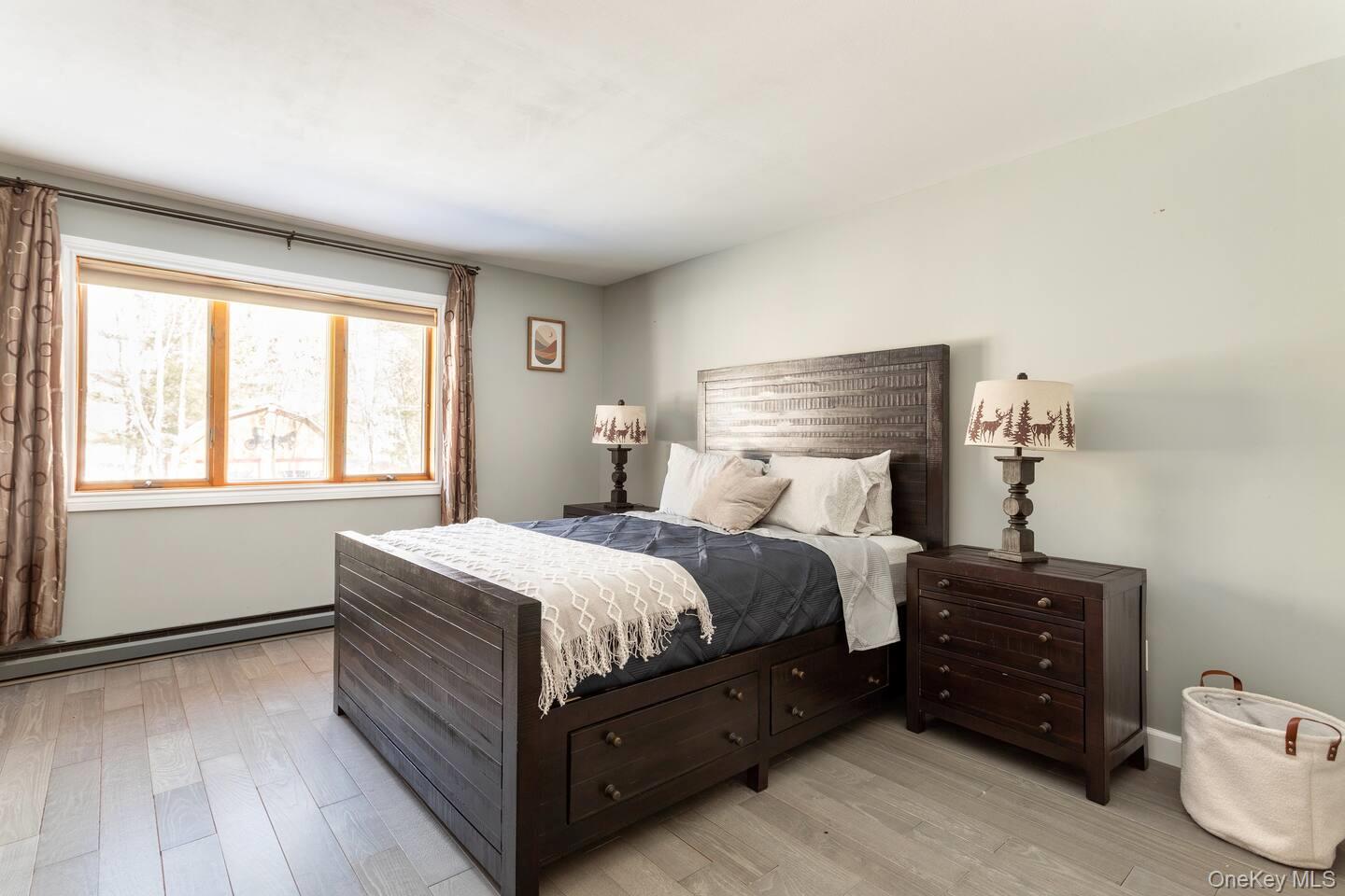 33 South Liberty Road Liberty, NY 12754 - Photo 12 of 12 a bedroom with a bed and window