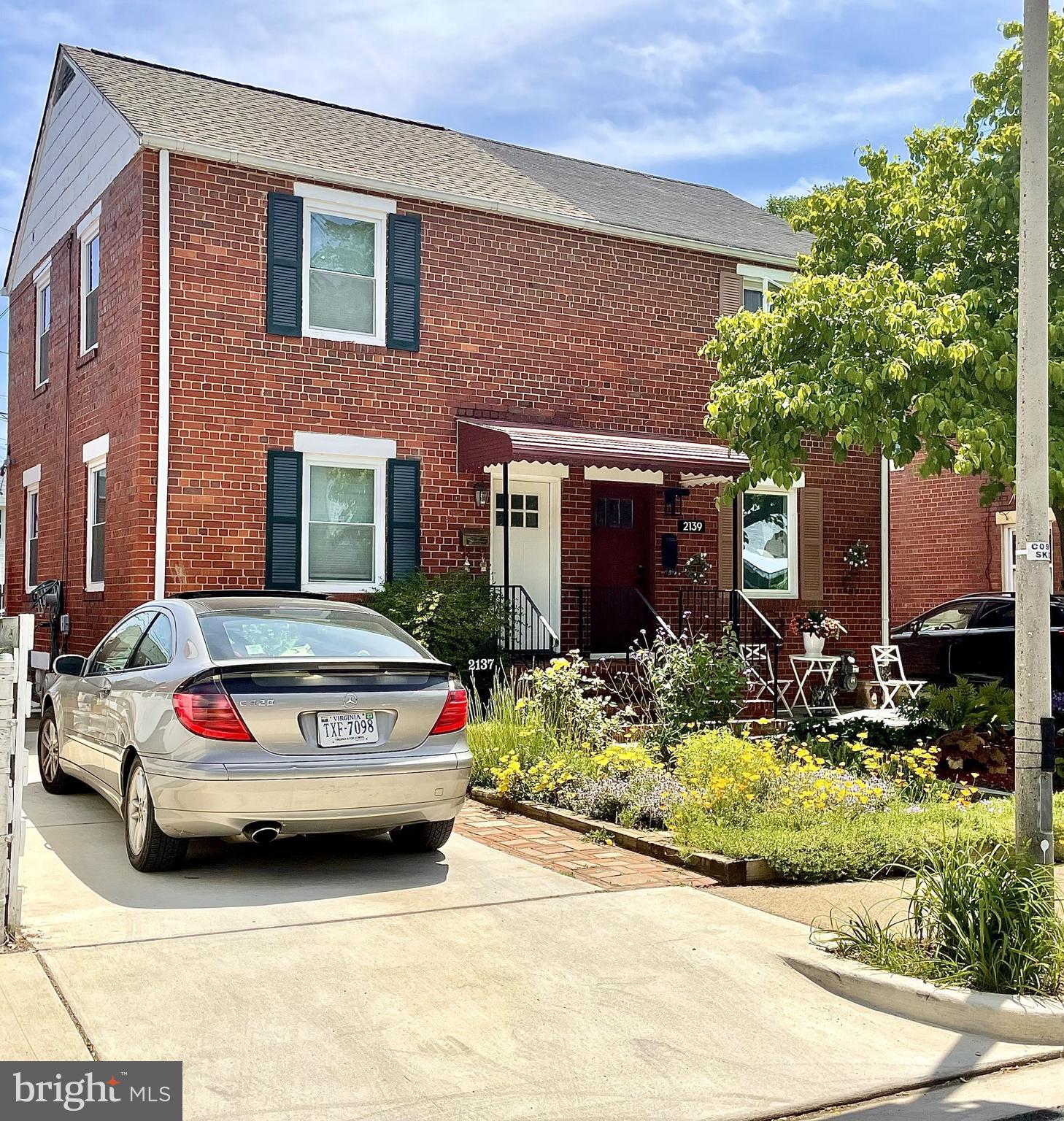 2137 South Pollard Street Arlington, VA 22204 - Photo 36 of 57 a car parked in front of a brick house