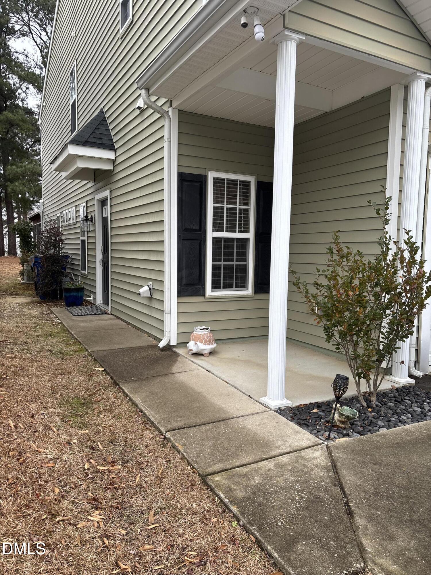 2136 Persimmon Ridge Drive Raleigh, NC 27604 - Photo 17 of 18 a front view of a house with garden