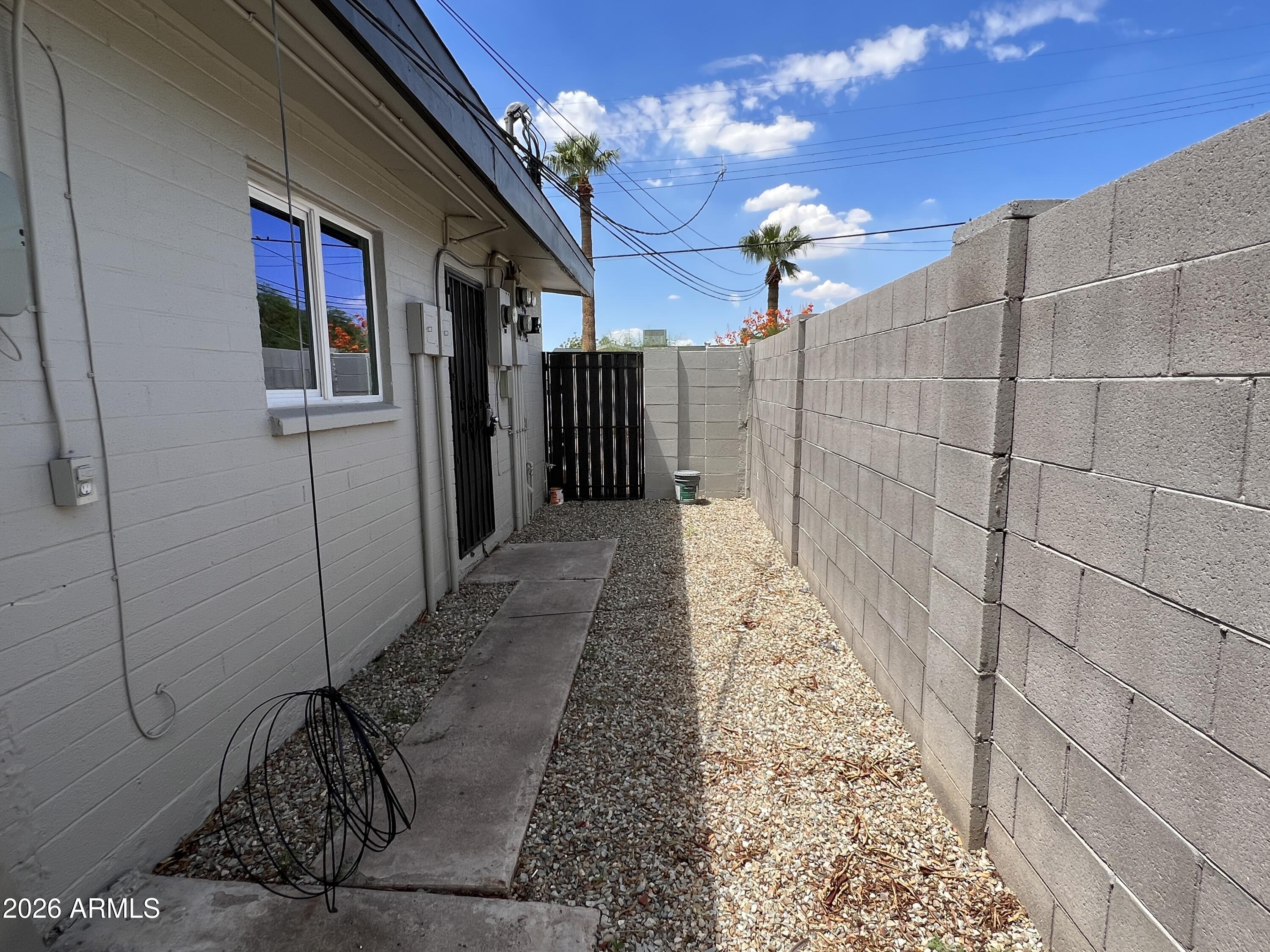 3630 North 15th Avenue Phoenix, AZ 85015 - Photo 12 of 12 a view of a hallway with wooden floor