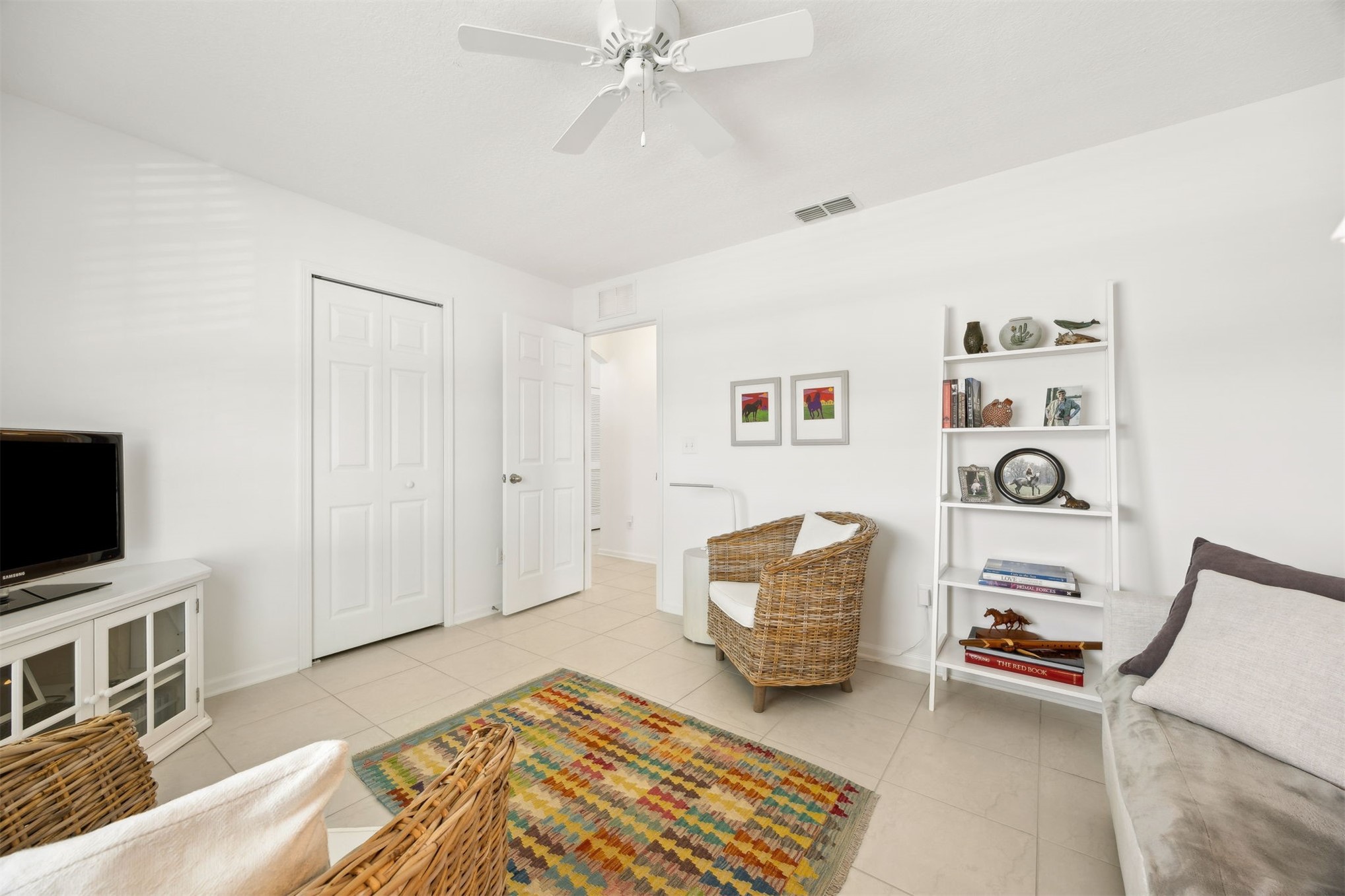 94037 Last Lane Yulee, FL 32097 - Photo 28 of 38 a living room with furniture and a flat screen tv