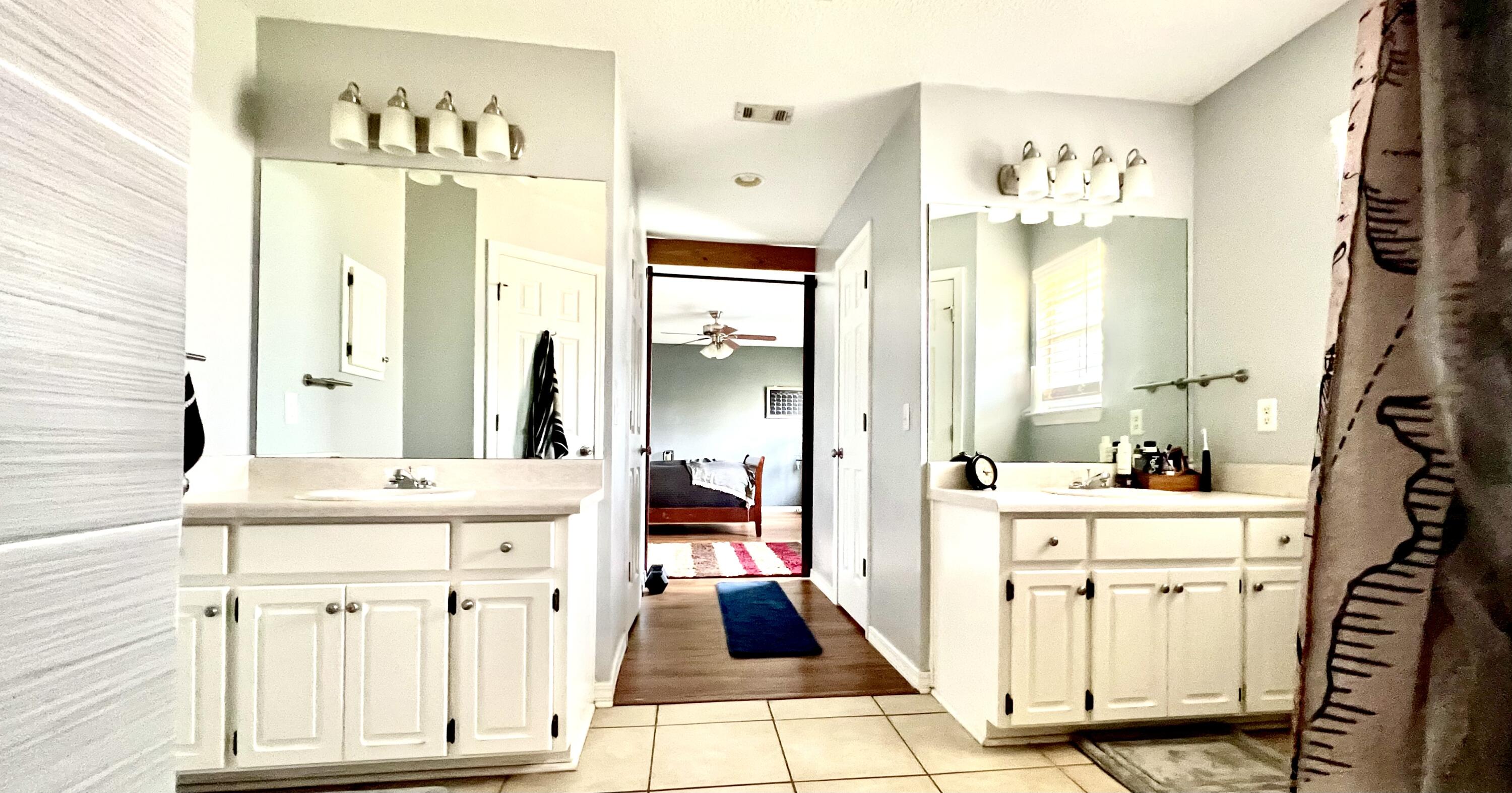 5304 Whitney Court Crestview, FL 32536 - Photo 12 of 13 a spacious bathroom with a double vanity sink mirror and