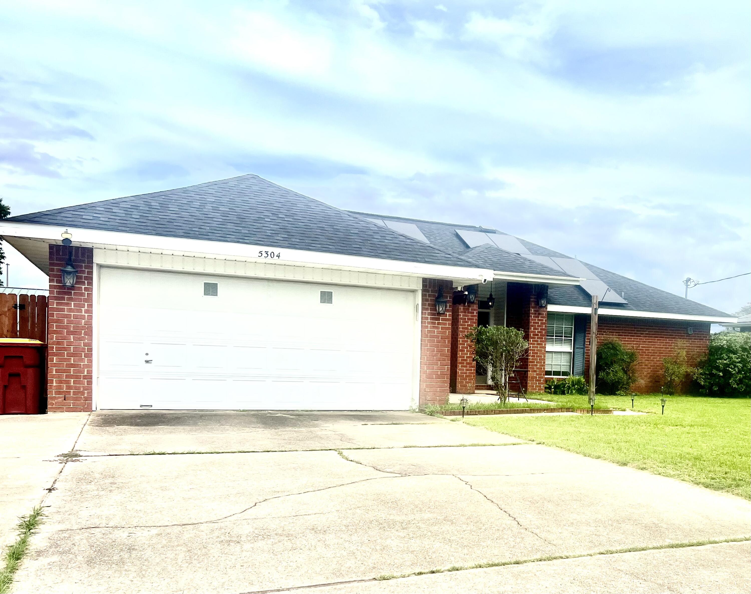 5304 Whitney Court Crestview, FL 32536 - Photo 2 of 13 a front view of a house with a yard