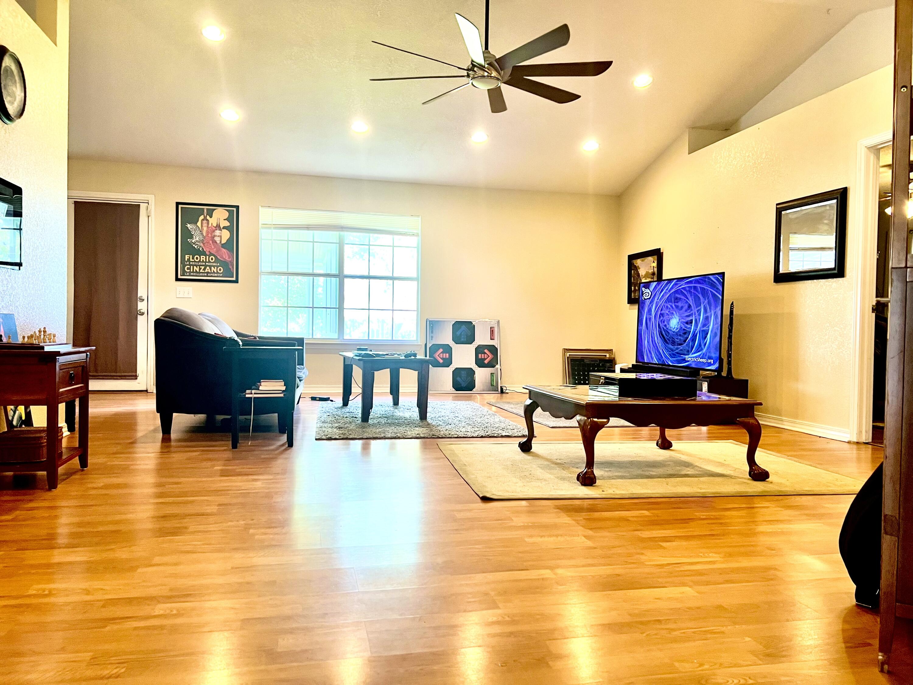 5304 Whitney Court Crestview, FL 32536 - Photo 3 of 13 a living room with furniture and a table with wooden floor