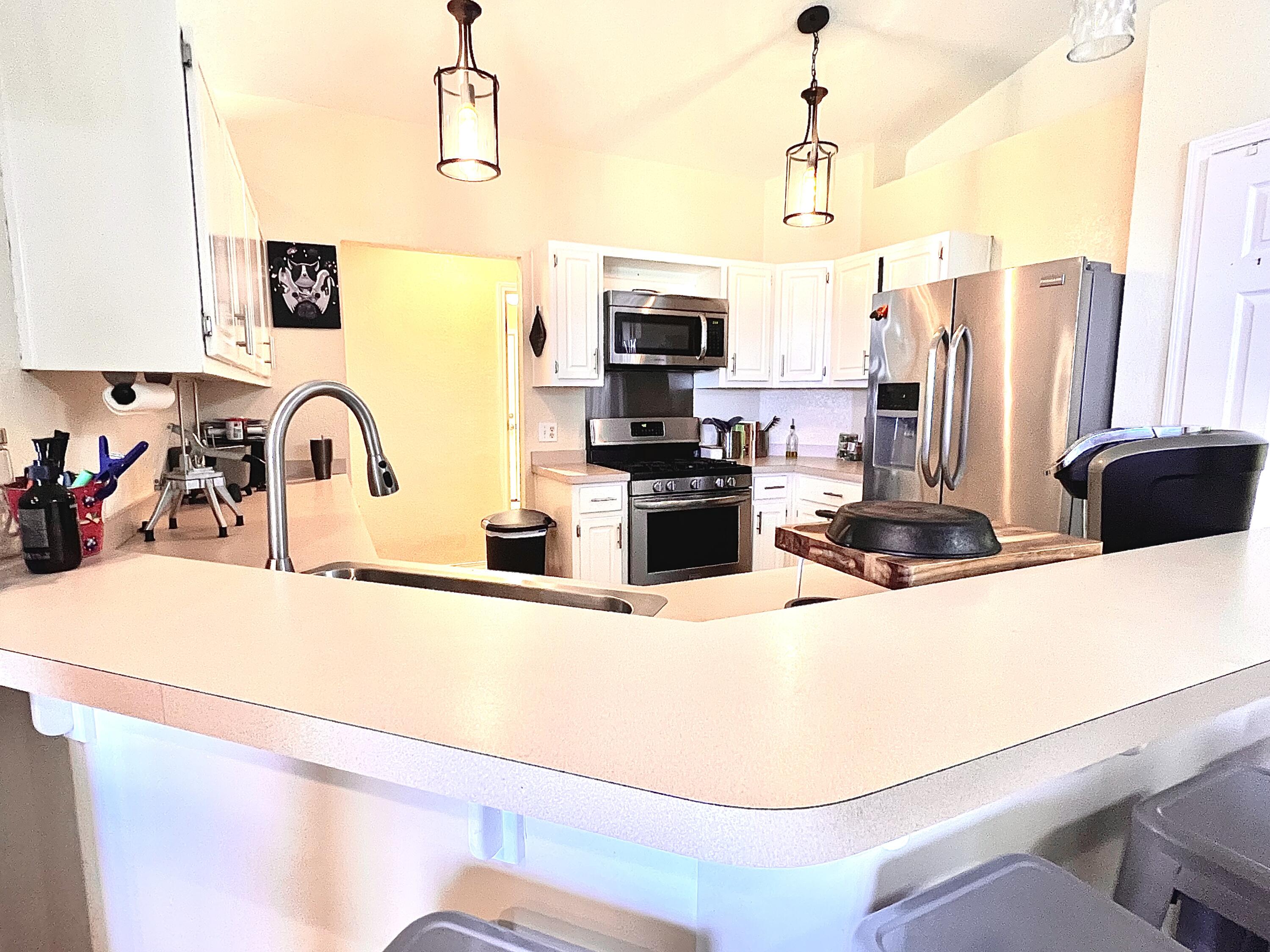 5304 Whitney Court Crestview, FL 32536 - Photo 6 of 13 a kitchen with stainless steel appliances a sink a stove and a refrigerator