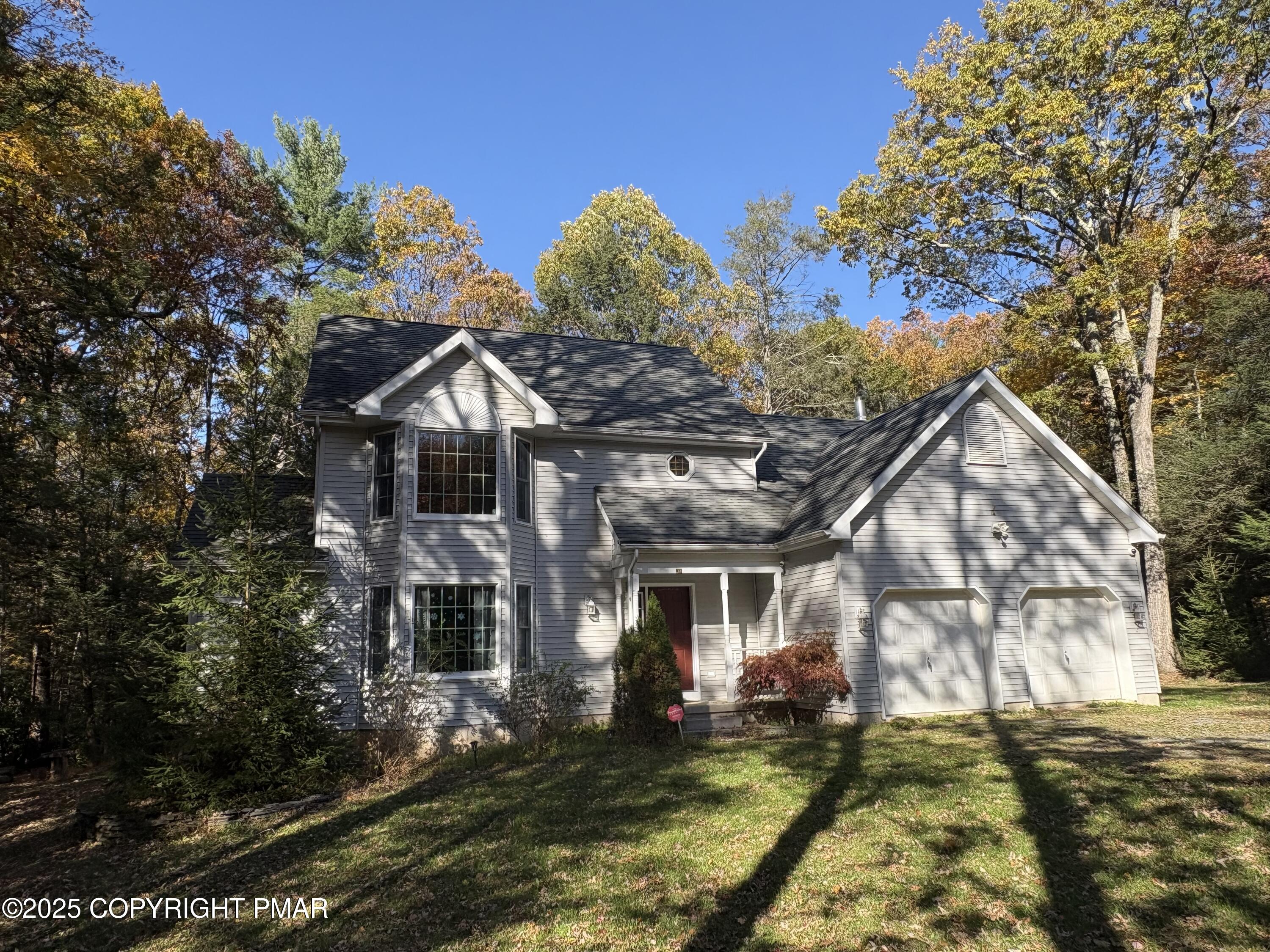 a front view of a house with a yard