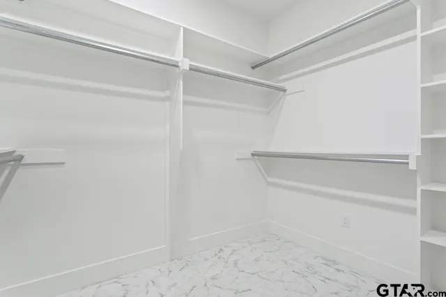 a view of an empty walk in closet