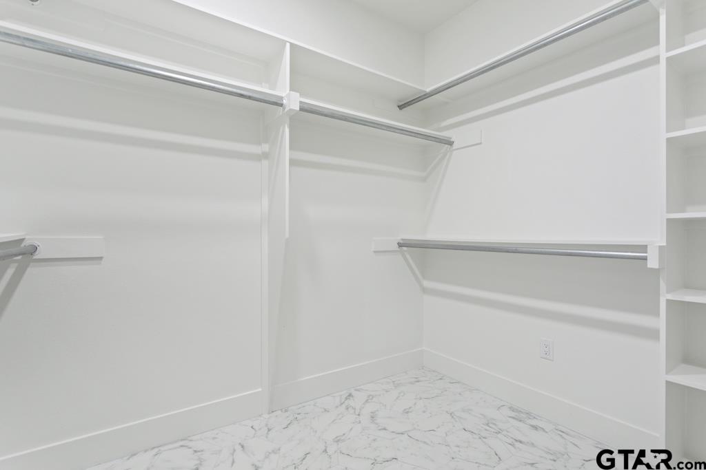 15837 Stillwaters Lindale, TX 75771 - Photo 18 of 34 a view of an empty walk in closet