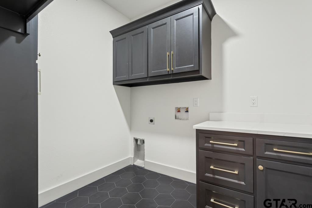 15837 Stillwaters Lindale, TX 75771 - Photo 24 of 34 a view of cabinets and wooden floor