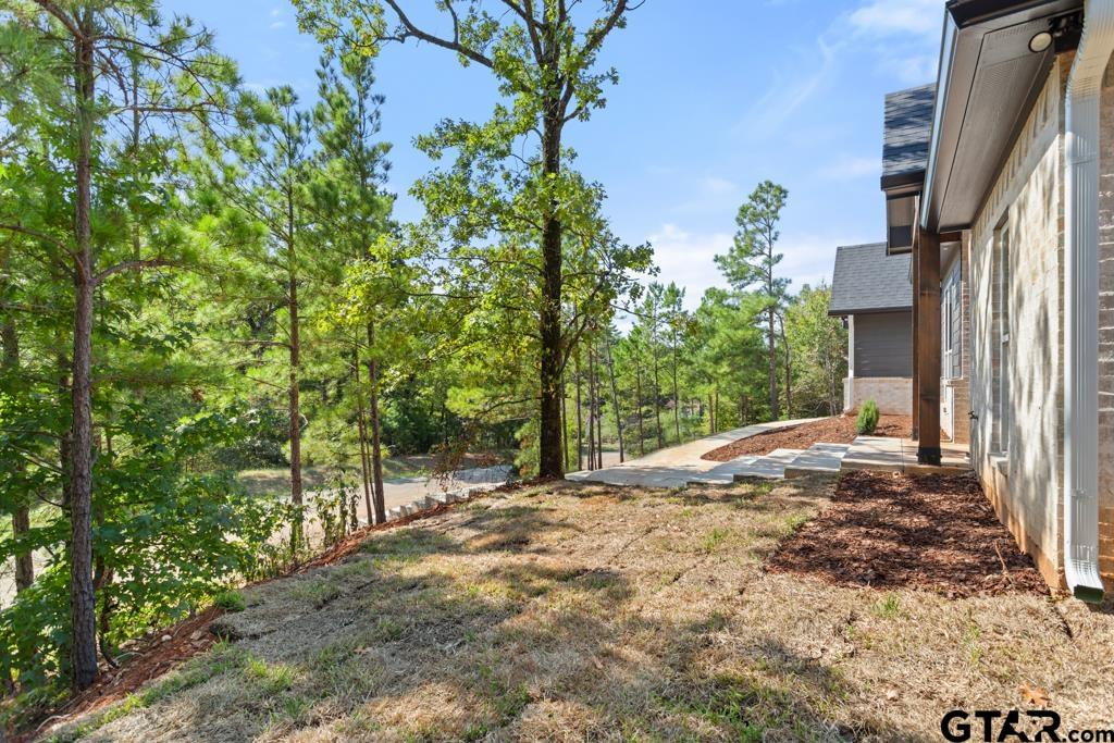 15837 Stillwaters Lindale, TX 75771 - Photo 28 of 34 a view of a house with a tree