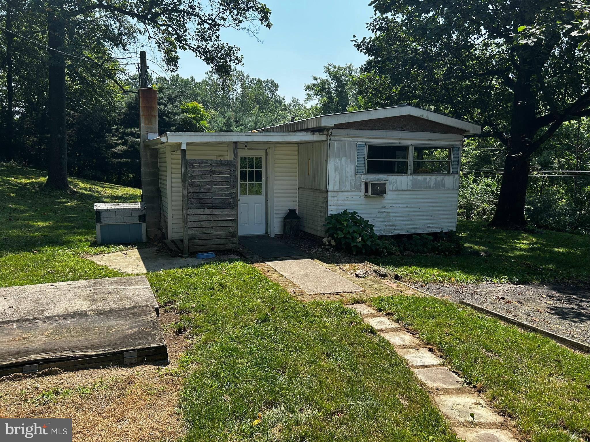 280 Spies Church Road Reading, PA 19606 - Photo 3 of 26 a front view of a house with a garden