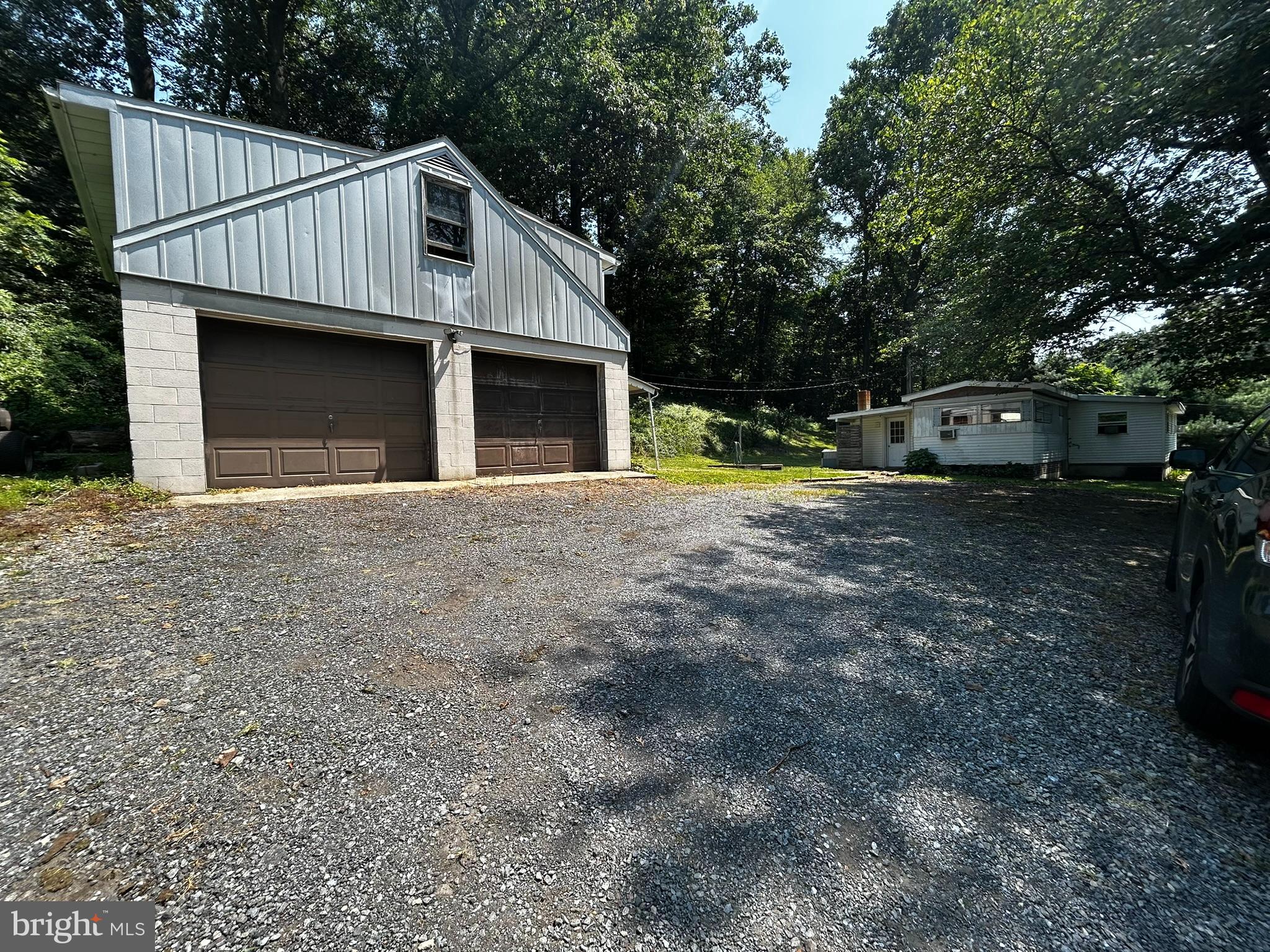 280 Spies Church Road Reading, PA 19606 - Photo 5 of 26 a front view of a house with a yard and garage