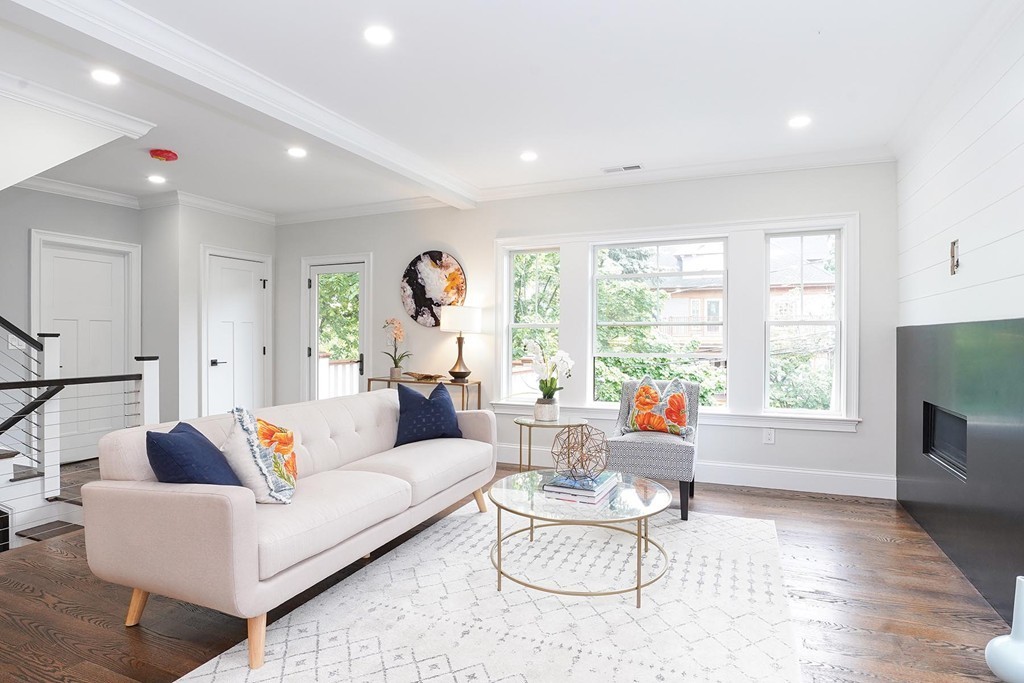 19 Verndale Street, Unit 2 Brookline, MA 02446 - Photo 2 of 8 a living room with furniture and a large window