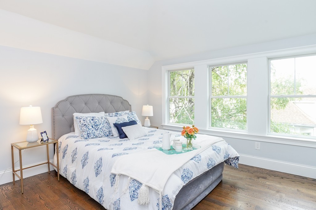 19 Verndale Street, Unit 2 Brookline, MA 02446 - Photo 4 of 8 a bedroom with a bed and a window