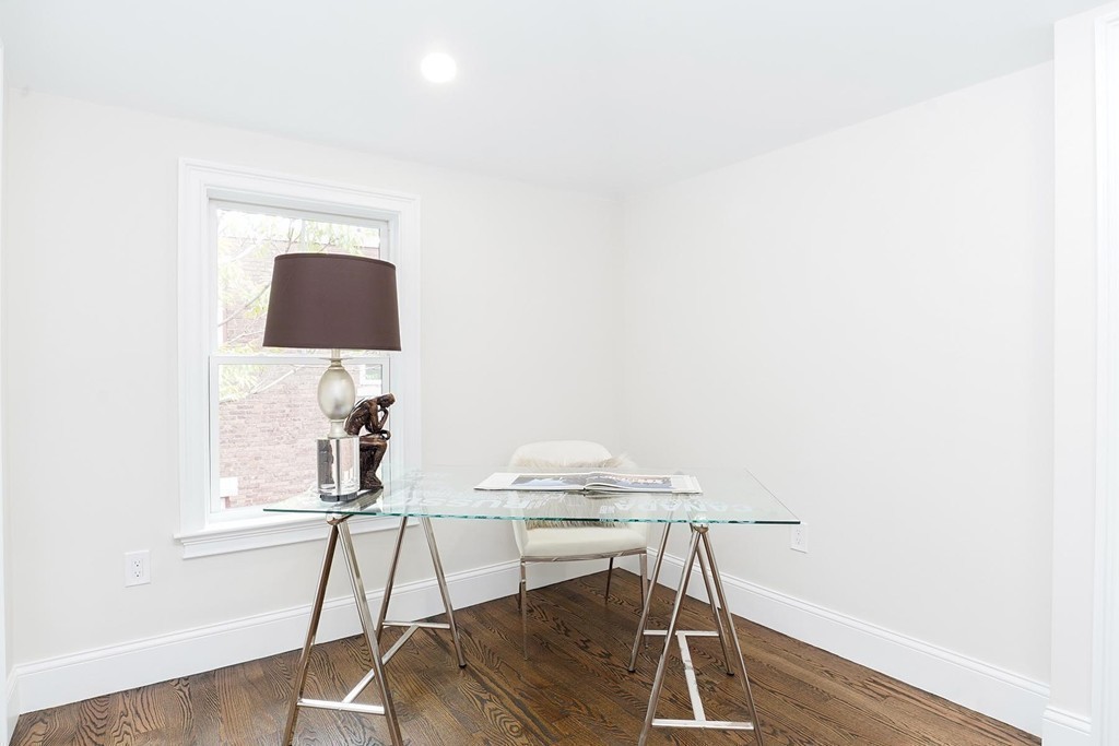 19 Verndale Street, Unit 2 Brookline, MA 02446 - Photo 6 of 8 a workspace with furniture and wooden floor