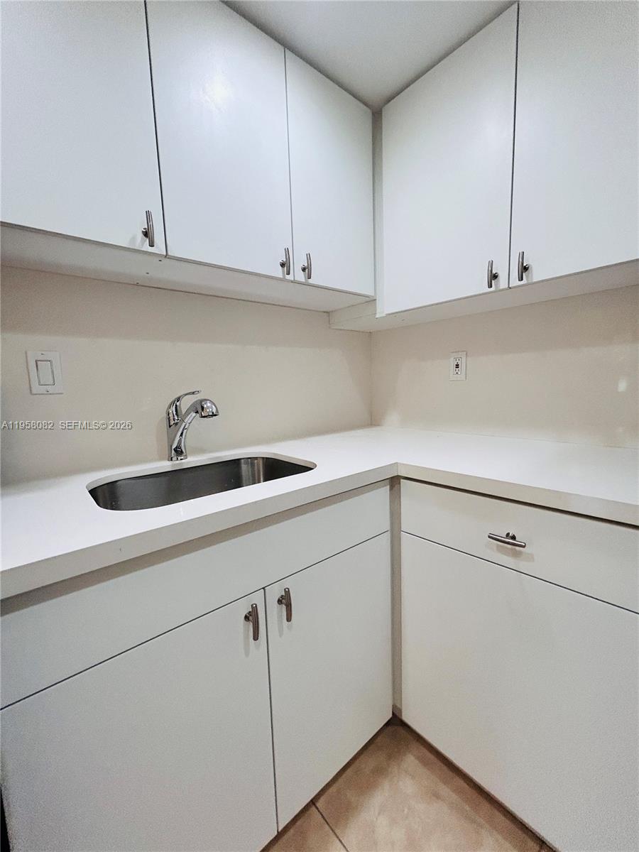 8603 Southwest 68th Court, Unit 22 Miami, FL 33156 - Photo 11 of 49 a view with cabinets