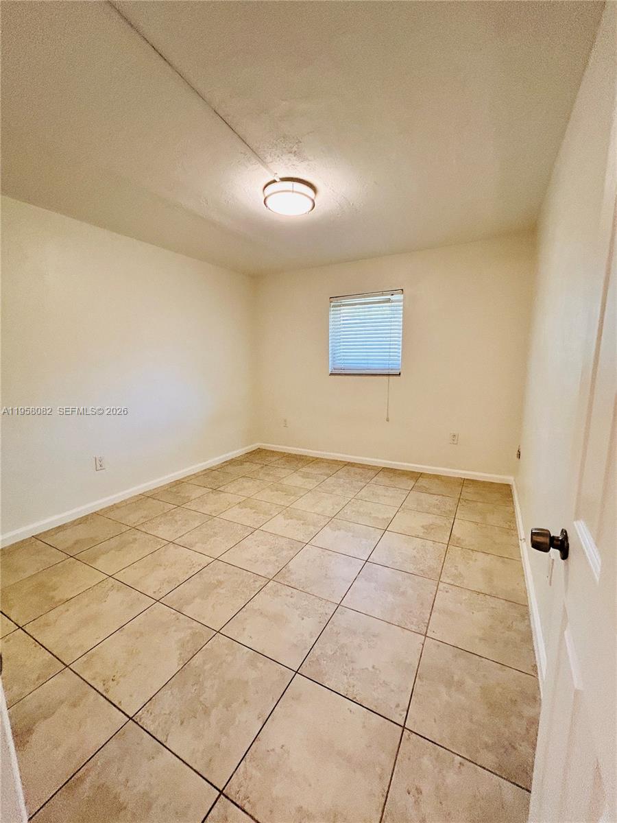 8603 Southwest 68th Court, Unit 22 Miami, FL 33156 - Photo 16 of 49 a view of a room with wooden floor
