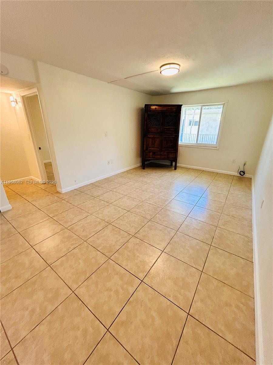 8603 Southwest 68th Court, Unit 22 Miami, FL 33156 - Photo 2 of 49 a view of an empty room and a window