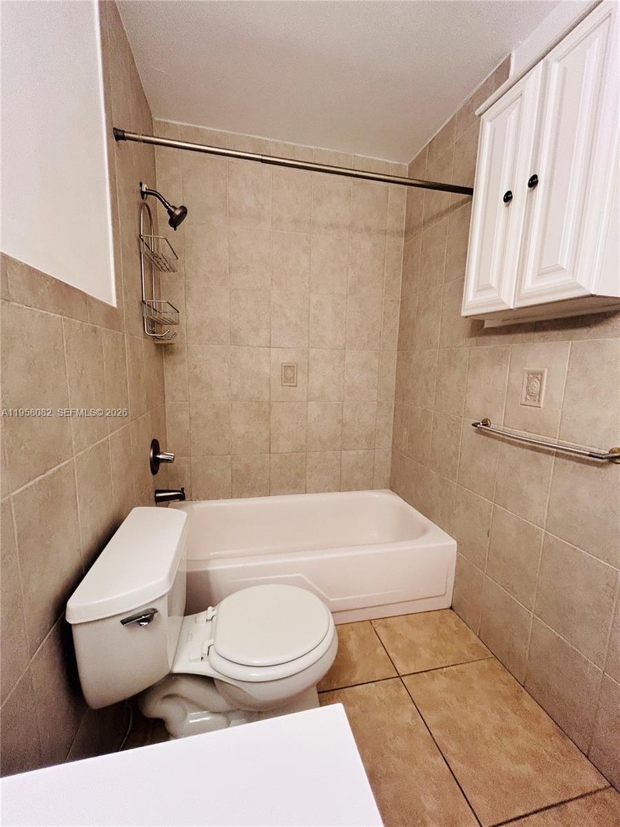 8603 Southwest 68th Court, Unit 22 Miami, FL 33156 - Photo 22 of 49 a bathroom with a toilet a sink and a shower