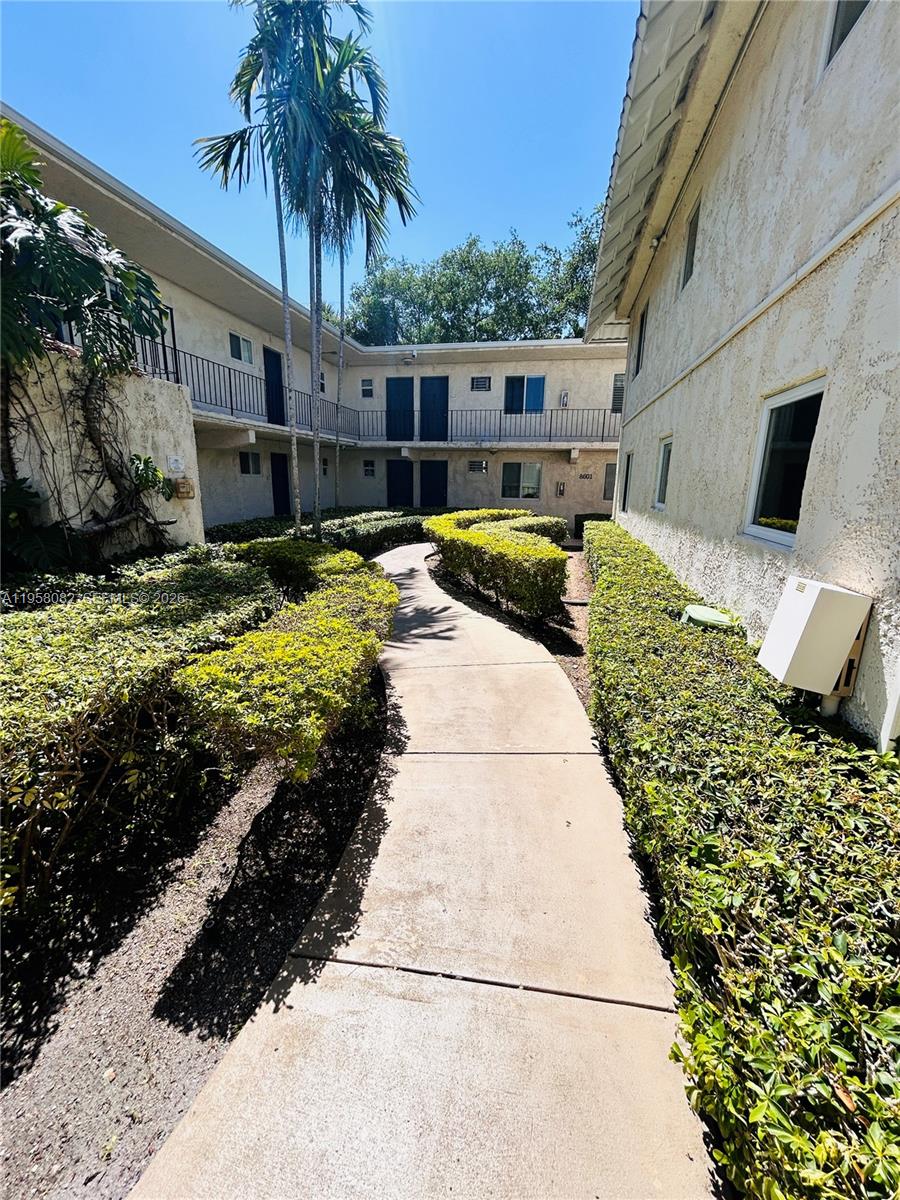 8603 Southwest 68th Court, Unit 22 Miami, FL 33156 - Photo 26 of 49 a view of a house with backyard and sitting area