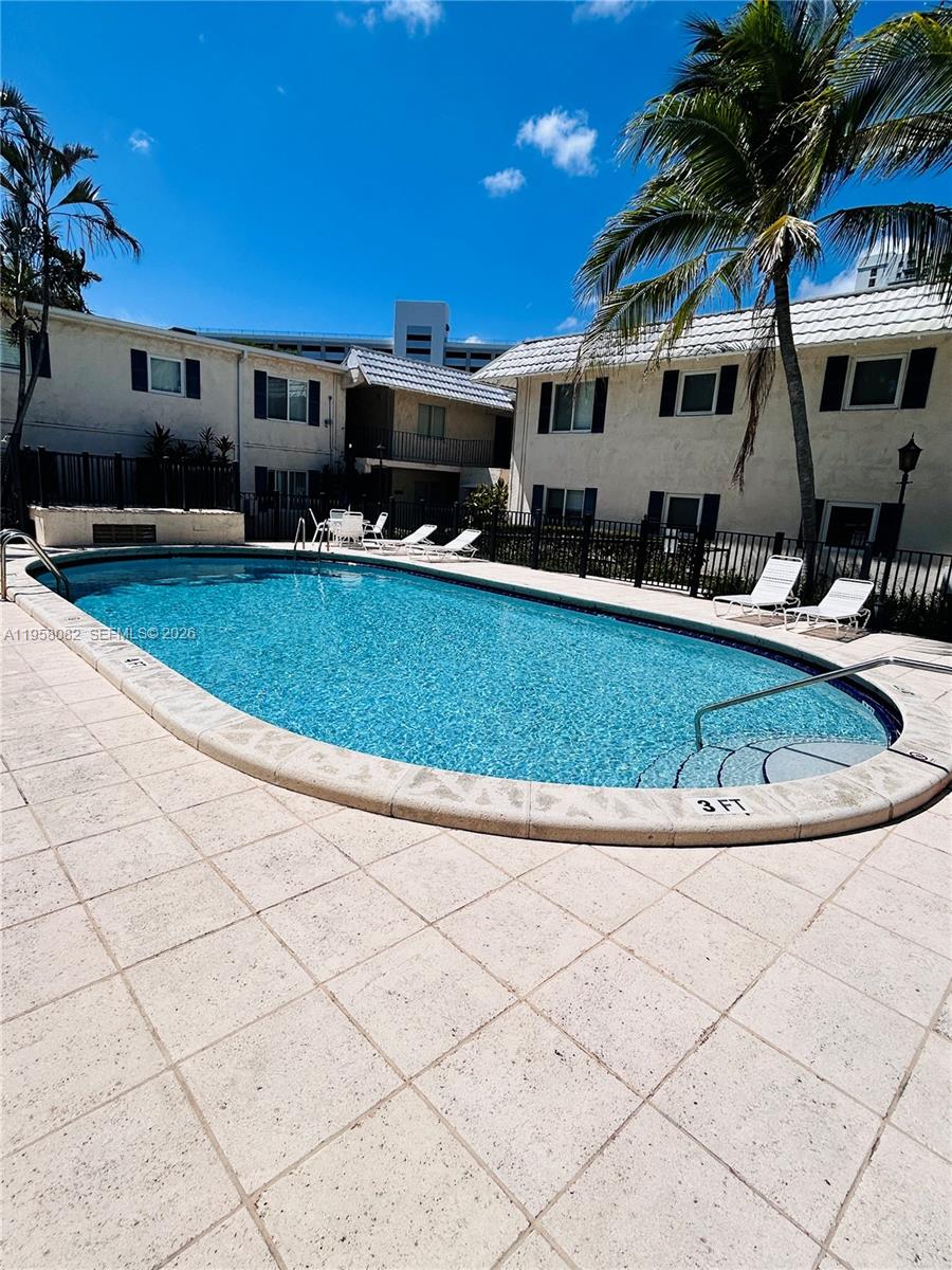 8603 Southwest 68th Court, Unit 22 Miami, FL 33156 - Photo 33 of 49 a view of a house with a swimming pool