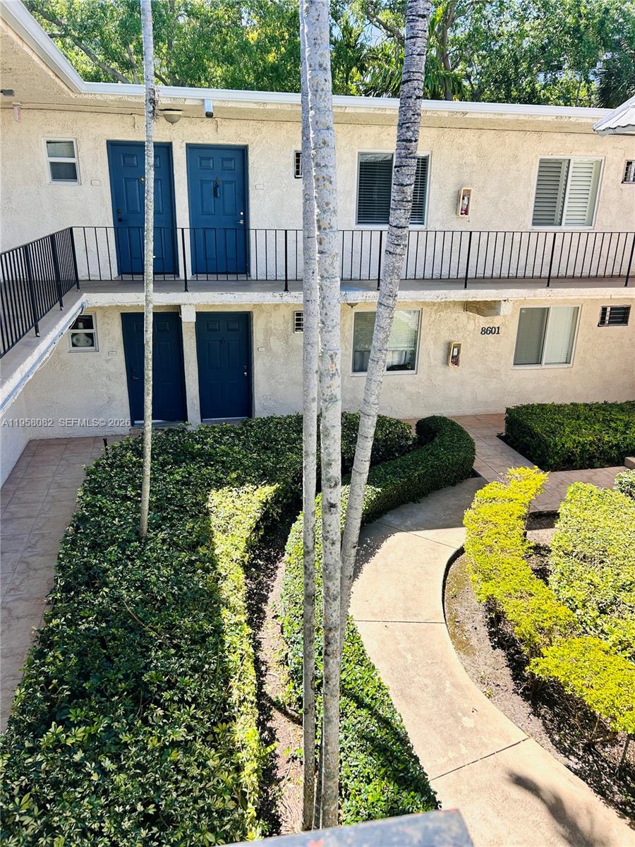 8603 Southwest 68th Court, Unit 22 Miami, FL 33156 - Photo 39 of 49 a view of a house with backyard and sitting area