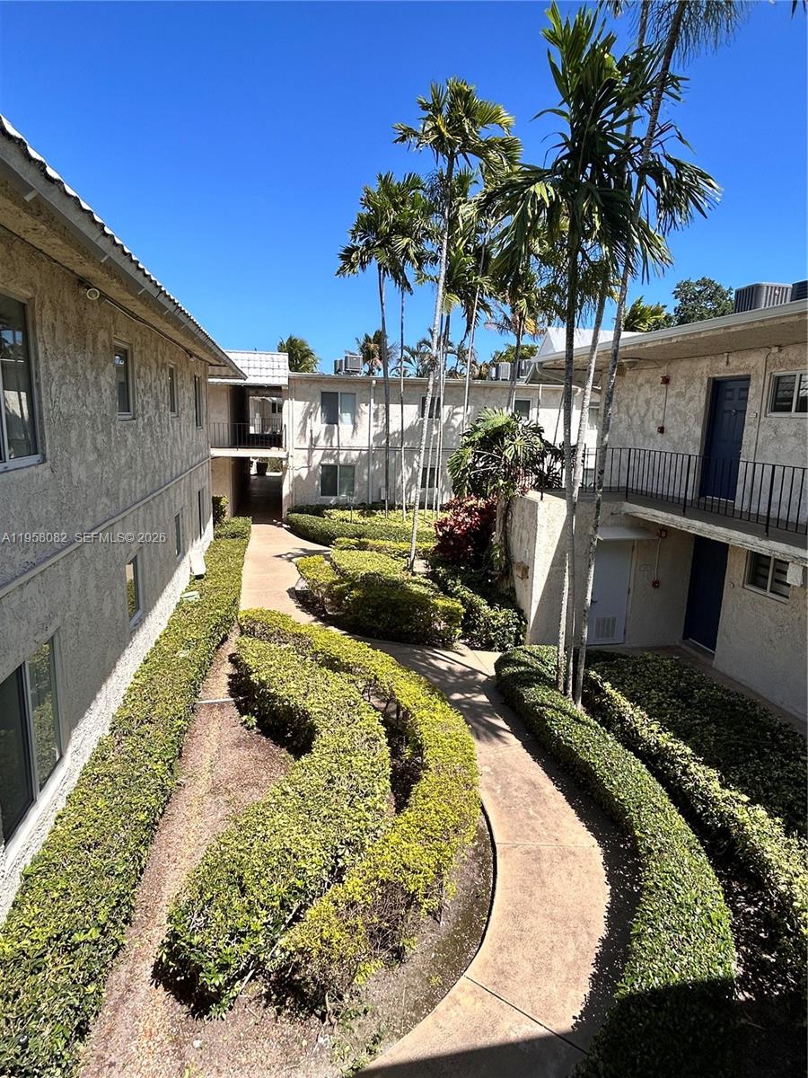 8603 Southwest 68th Court, Unit 22 Miami, FL 33156 - Photo 42 of 49 a swimming pool with outdoor seating and yard