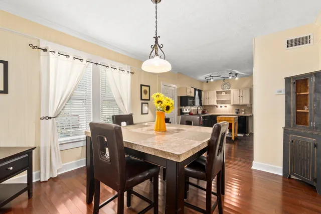 a bed room with a bed and a chandelier