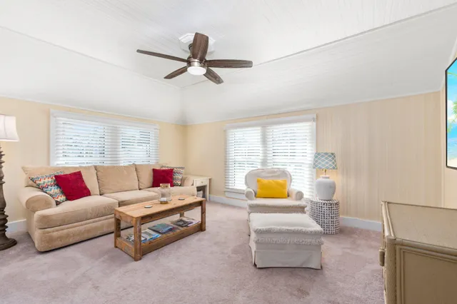 a view of a patio with a table and chairs under an umbrella