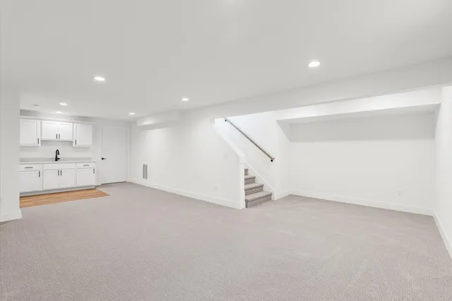 an empty room with white walls and white walls