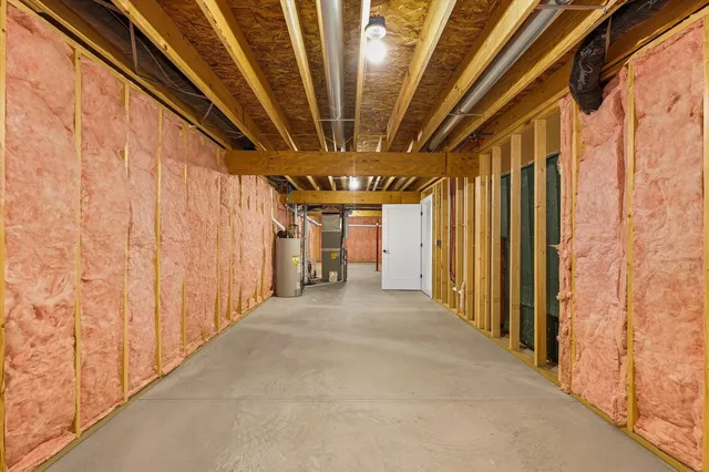 a view of a hallway with a yellow lightning and door