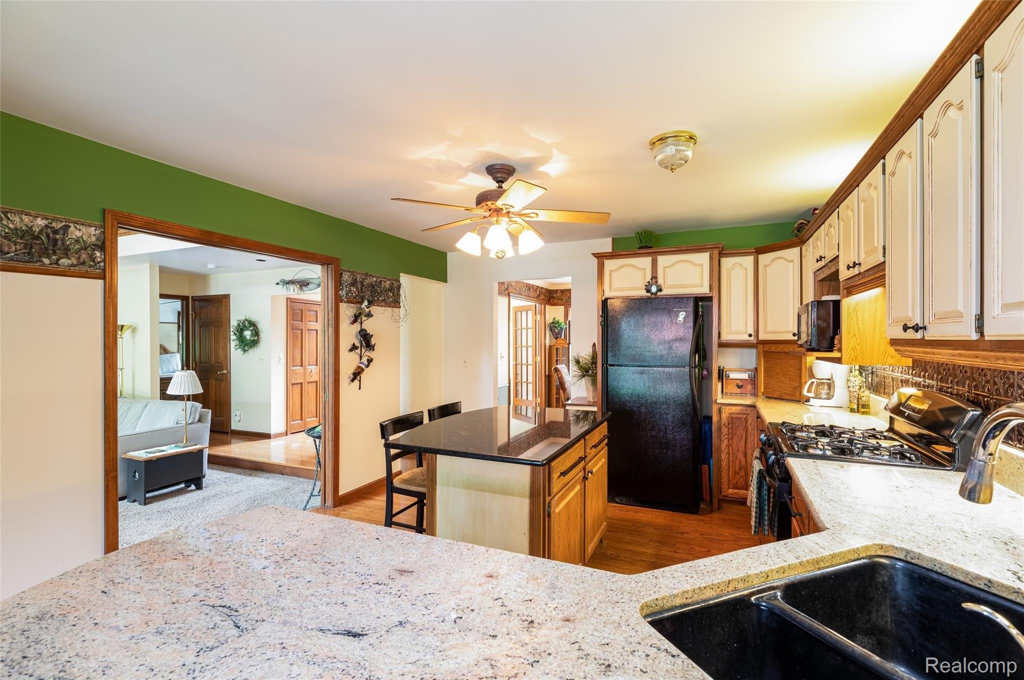 7751 Ridge Road Canton, MI 48187 - Photo 16 of 48 Granite Kitchen W/Center Island Bar Seating