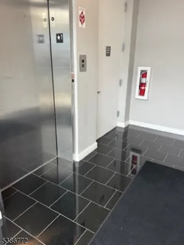 a bathroom with a shower and a sink