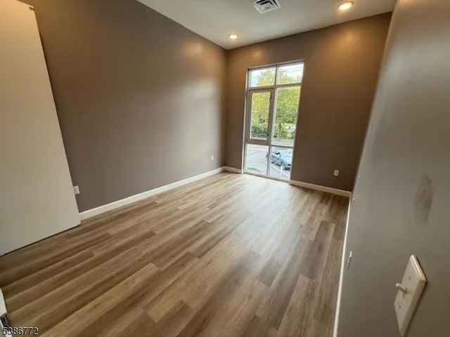 wooden floor and window in an empty room