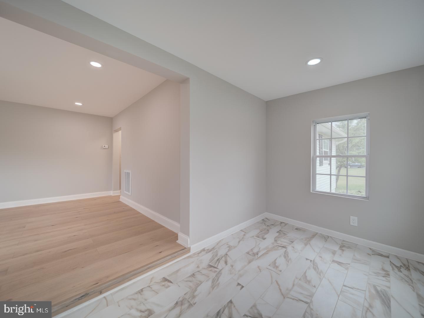 842 South Stepney Road Aberdeen, MD 21001 - Photo 12 of 50 a view of an empty room with wooden floor and a window
