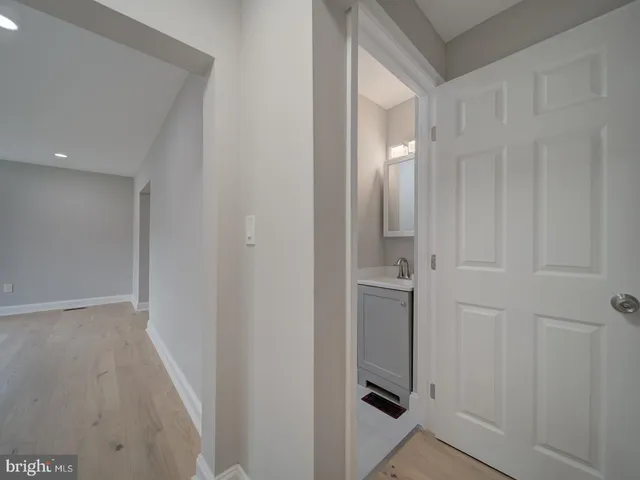 a bathroom with a sink and vanity
