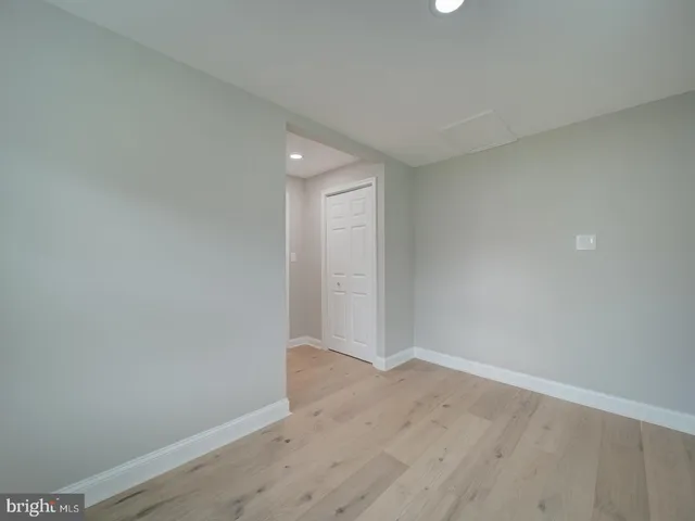 a large kitchen with granite countertop a large counter top stainless steel appliances and cabinets