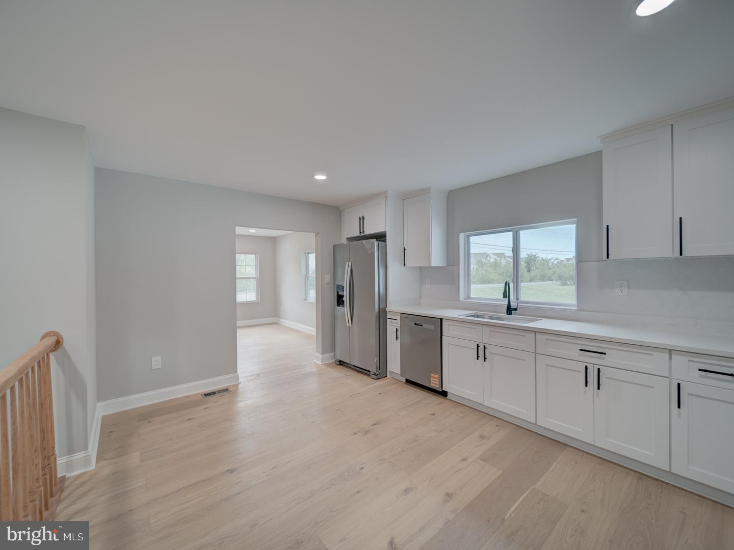 842 South Stepney Road Aberdeen, MD 21001 - Photo 38 of 50 a large white kitchen with stainless steel appliances granite countertop a refrigerator and a sink