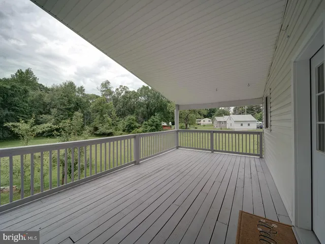 a view of balcony with wooden floor