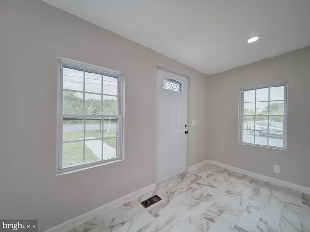 a view of an empty room and window